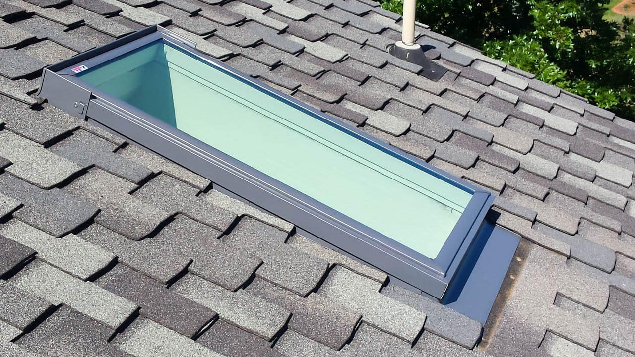 deck mounted type of skylights on asphalt shingle roof